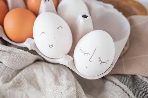 Monochrome easter eggs with faces top view. Easter holiday concept. Rustic Stock Photos