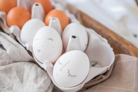 Monochrome easter eggs with faces top view. Easter holiday concept. Rustic Stock Photos