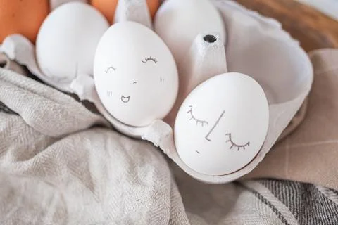 Monochrome easter eggs with faces top view. Easter holiday concept. Rustic Stock Photos
