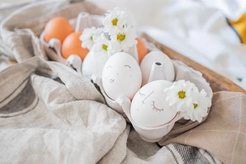Monochrome easter eggs with faces top view. Easter holiday concept. Rustic Stock Photos