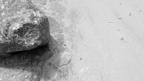 Monochrome high angle landscape view captures a large rough river stone roc.. Stock Photos