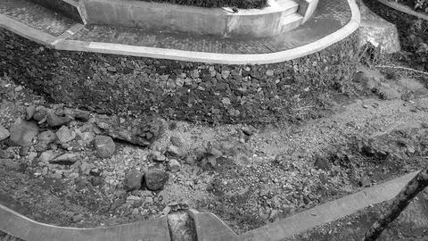 Monochrome high angle view showcases a terraced park landscape featuring a .. Stock Photos