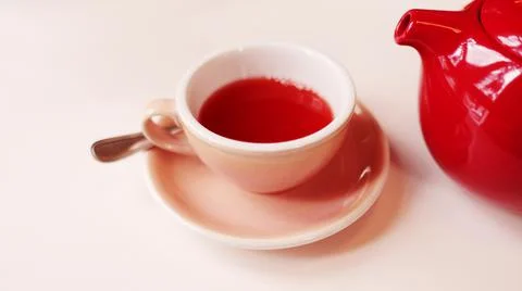 Monochrome image of raspberry or berry tea in cups with a teapot. Stock Photos