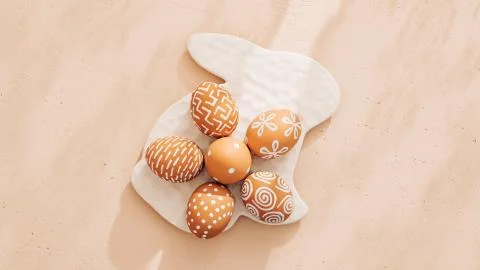 Monochrome minimalist Easter composition in spring warm pastel tones Stock Photos