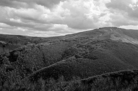 Monochrome mountain landscape with dramatic cloudy sky Фото