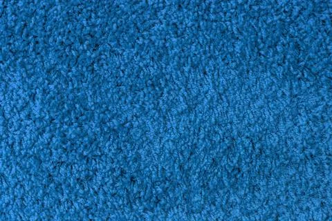 Monochrome pattern texture of surface of blue fabric carpet with threads. Fotos de archivo