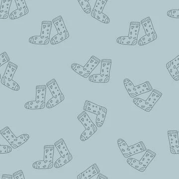 Monochrome vector seamless pattern with knitted socks on green background. Wi Illustrazione stock