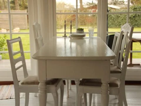 Monochrome White Dining Table Set with Chairs Stock Photos