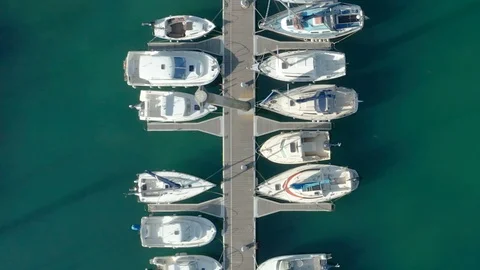 Monoco Top down aerial tracking shot of jetty with boats and people v2 Stock Footage 119537447
