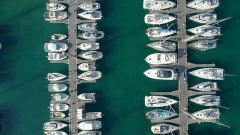 Monoco Top down aerial view of two jetties with boats and people Stock Footage 119975610
