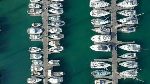 Monoco Top down aerial view of two jetties with boats and people, slow track Stock Footage 119976508
