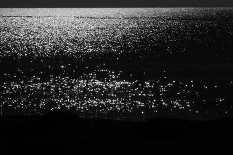 Monocromatic sunset on the beach Stock Photos