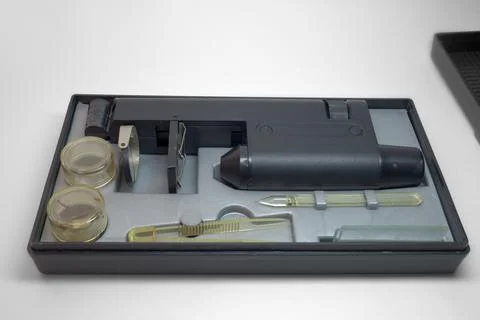 Monocular microscope in portable case for storing with tools and asseseorie.. Stock Photos