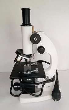 Monocular optical microscope for school laboratory. Fotos de archivo