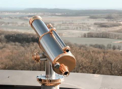 Monocular telescope at sunset with a cloudy sky 写真素材