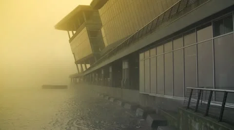Monolithic Building Complex Disappearing Into Yellow Glowing Fog Video stock 19066599