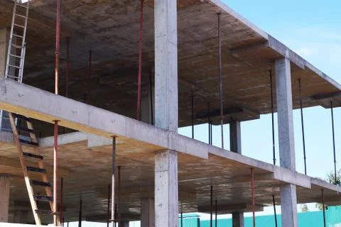 Monolithic construction, concrete frame of the building Stock Photos
