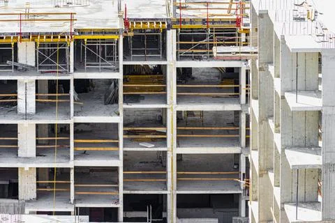 Monolithic frame construction of the building. Solid walls of concrete. Stock Photos