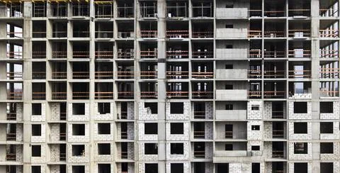 Monolithic frame construction of the building. Solid walls of concrete. Stock Photos