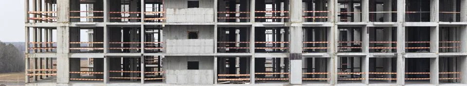 Monolithic frame construction of the building. Solid walls of concrete. Stock Photos