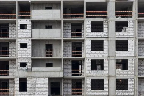 Monolithic frame construction of the building. Solid walls of concrete. Stock Photos