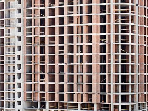 Monolithic frame construction on facade - building under construction. Stock Photos