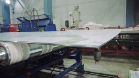 Monolithic polycarbonate sheet lies on conveyor belt Stock Footage 231219145