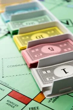 Monopoly board game in play Stock Photos
