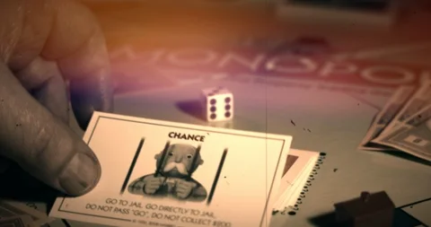 Monopoly board game. Player gets Go To Jail Card, moves car to jail. Stock Footage 122406407