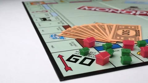 Monopoly money and house smooth macro slider shot Stock Footage