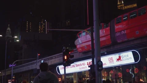 Monorail passing through over railway at Bukit Bintang city link Stock Footage 107345814
