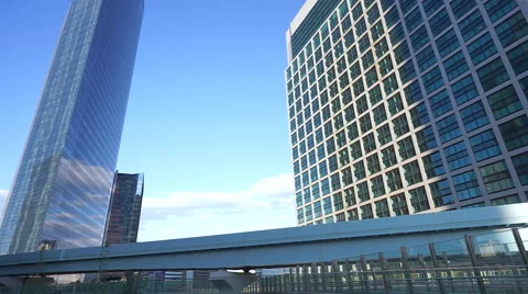 Monorail running between the skyscrapers Stock Footage 66654149