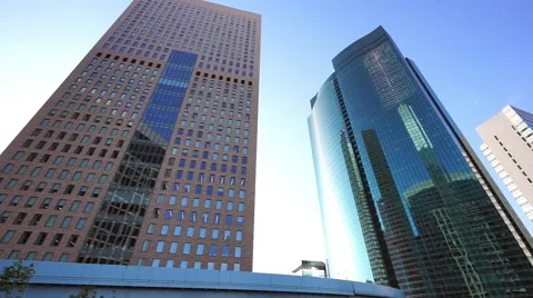 Monorail running between the skyscrapers Stock Footage 66654440