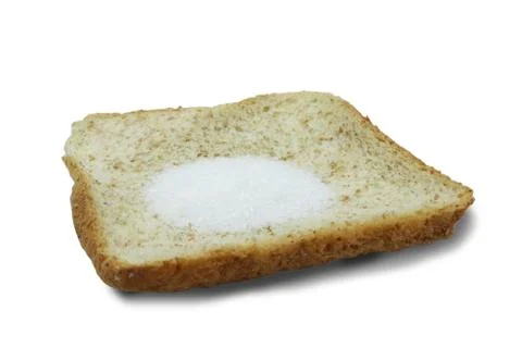 Monosodium glutamate (MSG) on slice breads isolated on white background. Stock Photos