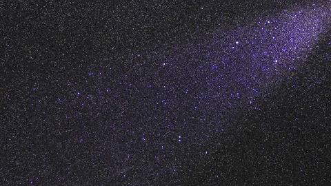 A monotonous black background in fine grain and a flashing light beam Stock Footage 232747924