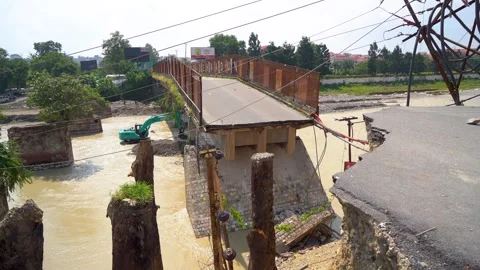 Monsoon flood causing road and bridge damage in Dehradun India Stock Footage 321041081