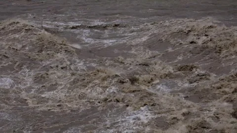 Monsoon floodwaters rising in the beas river himachal Stock Footage 322509732