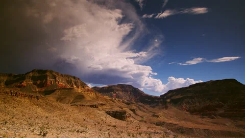 Monsoon storm clouds over the painted buttes of the Arizona Desert Stock Footage 196259019
