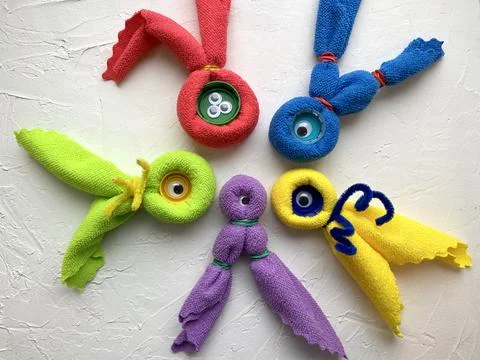 Monster ghosts from microfiber cloths, rubber bands, master class Kids craft. Stock Photos
