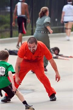 Monster tries to catch kid running in atlanta zombie run Stock Photos