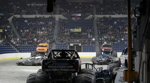 Monster trucks jumping side by side Stock Footage 8959306