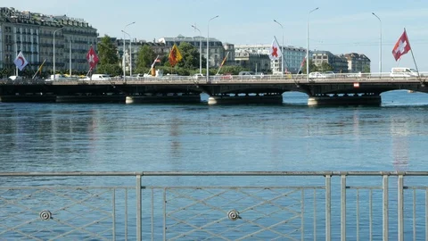 Mont-Blanc bridge with flags floating over Leman lake Video stock 129956614