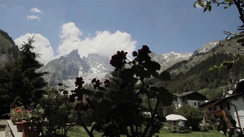 Mont Blanc mountain range snow on top view far from villa plants in flowerpots Stock Footage 85624797