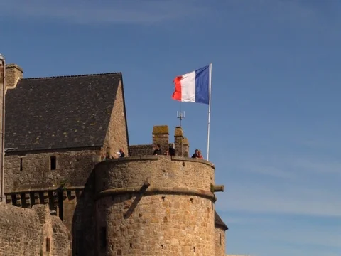 Mont St. Michel - Flag pulling back to entrance Stock Footage 81355146