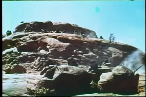 Montage of Apache shootout from rocky outpost 動画素材 11366480