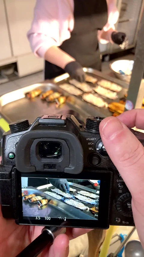Montage of a chef's hands preparing eggplant rolls in a modern kitchen. Stock-Footage 338033998