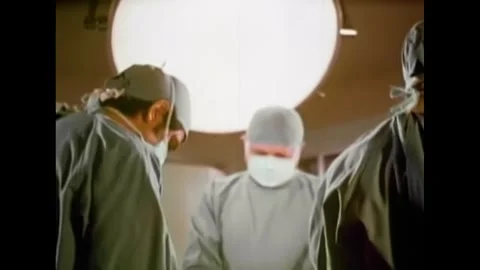 MONTANA - 1971 - Surgeons work on Evel Knievel after his crash, discussing his Stock Footage 340579703
