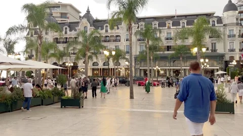 MONTE CARLO, MONACO - AUGUST 18, 2024: People walk on a city square Stock Footage 314651786