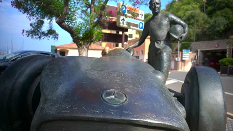 Monte Carlo, Monaco - August 25, 2024: Juan Manuel Fangio bronze statue at Stock Footage 306367744