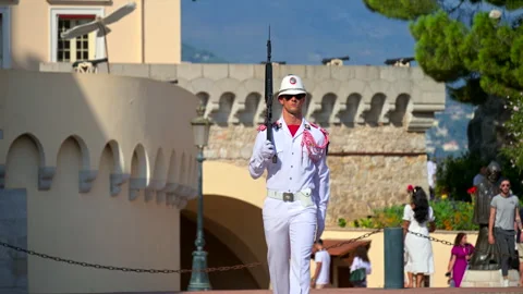 Monte Carlo, Monaco - August 25, 2024: Guard dressed in white marching at the Stock Footage 306369238